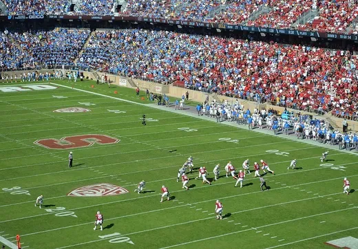 Wide-angle view of a Stanford Cardinal football game at Stanford Stadium with fans in the stands