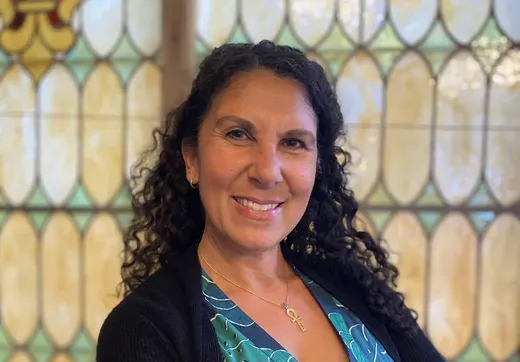 Heidi Saleh in front of stained glass window